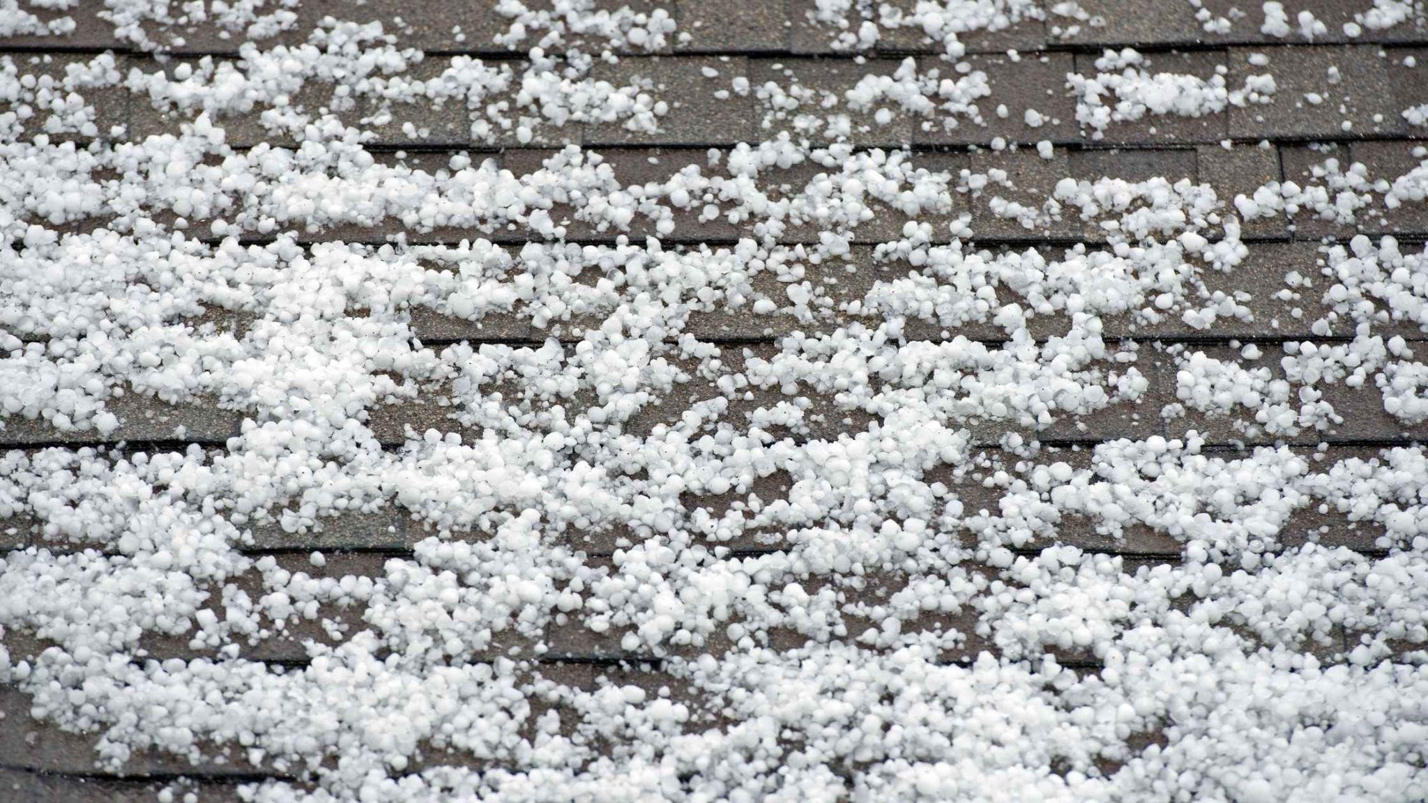 Shingle roof covered with hailstones